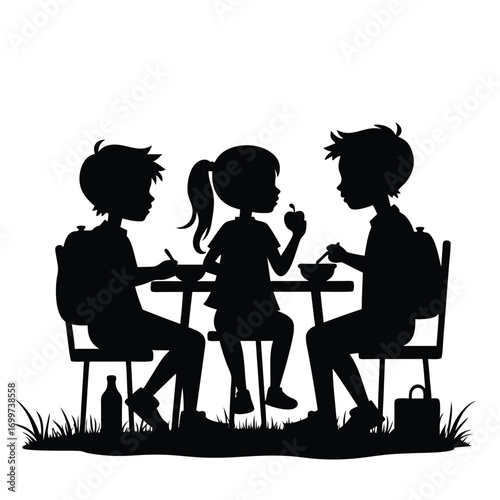 Three children eating lunch at a table with backpacks Keywords: children, eating, lunch, table