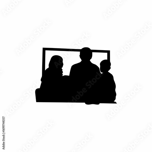 Silhouette of a family watching television together isolated on white background