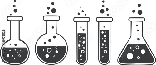 Bubbling laboratory flasks and test tubes with dark liquid laboratory equipment
