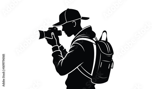Silhouette of a photographer with a backpack taking a picture