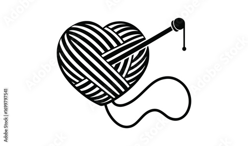Heart shaped yarn ball with knitting needle and loose thread
