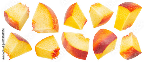 Peach slices isolated on white background with clipping path, falling nectarine cubes