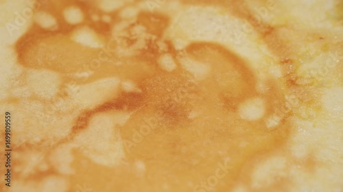 Crepes cooking on a hot pan. Crepe texture. High quality 4k footage