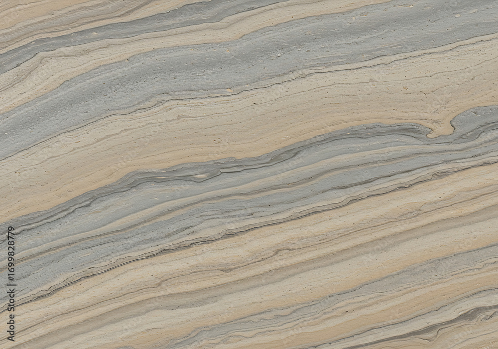 Fototapeta premium Brown and yellow textured sand dunes show a natural rippled pattern from the wind, like abstract waves on a dry desert surface