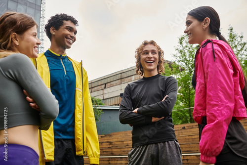 Φωτογραφία Young athletes enjoy a lively and friendly conversation during an outdoor practi