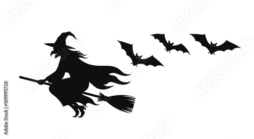 Spooky halloween witch flying with bats silhouetted against the night sky