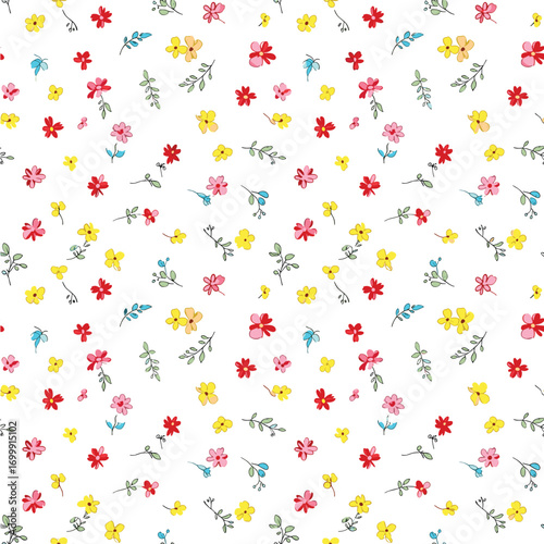 Charming tiny floral bouquet pattern in delicate shades of pink yellow and red on white background for spring and summer apparel and decor