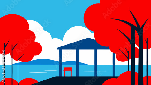 A gazebo near the water with red trees near
