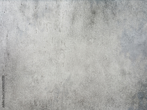 Cracked concrete wall covered with gray cement surface. Grey old wall with shabby damaged plaster or cement and brick background of an vintage dirty exfoliating plaster. Mock up.