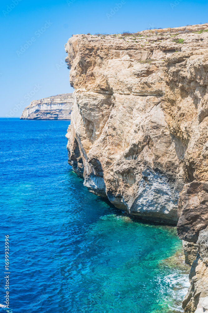 Fototapeta premium Landscape of coast with cliffs in the Mediterranean Sea, Dwejra - Gozo, Malta