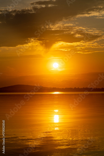Fototapeta Naklejka Na Ścianę i Meble -  Bright, colorful summer sunset over Lake Mitkow in Poland. Evening landscape.