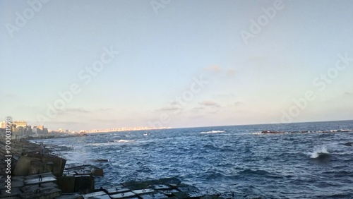 Mediterranean Sea Waves at Sunset – Alexandria Skyline