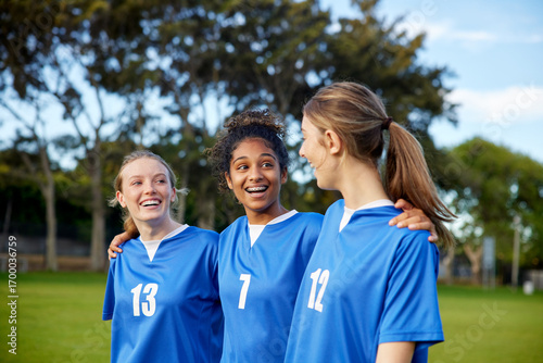 Wallpaper Mural Girls teammates laughing and walking on football field Torontodigital.ca
