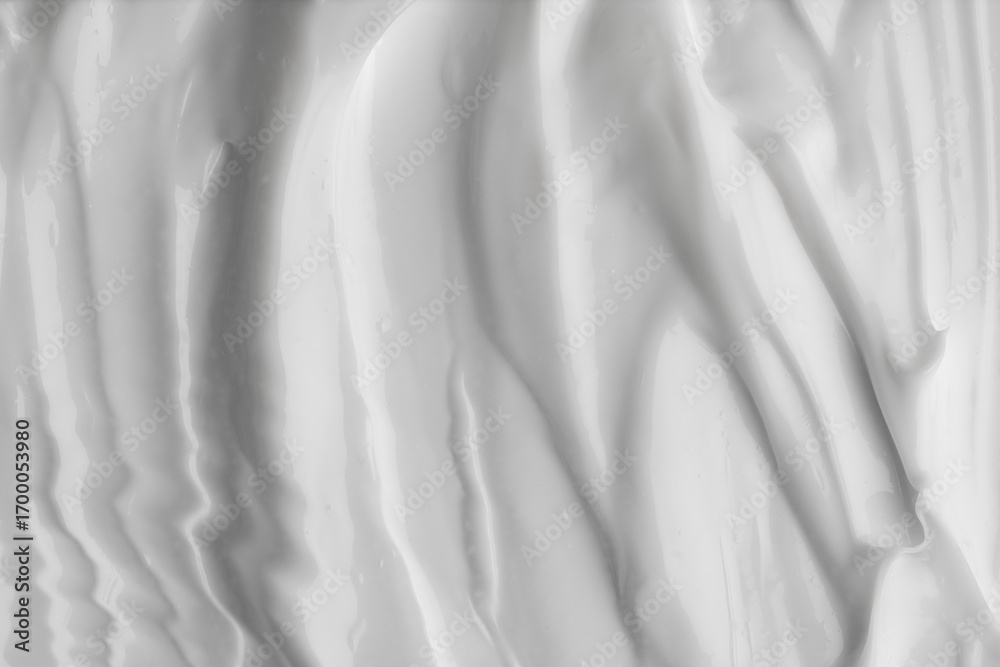Obraz premium Glossy moisturizing cream with soft flowing folds, hydrating cream texture with smooth glossy streaks