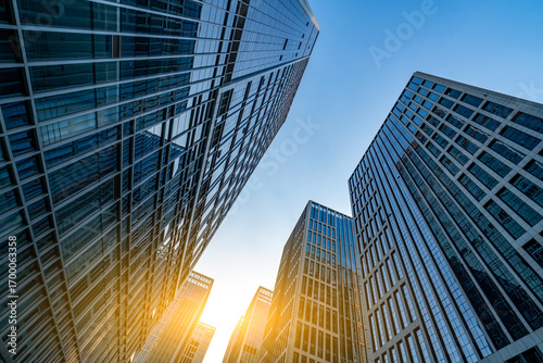 Modern skyscrapers under a clear blue sky showcasing urban architecture
