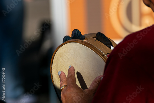 Quadro su tela The rhythm of a tambourine at a live folk performance, Live Performance