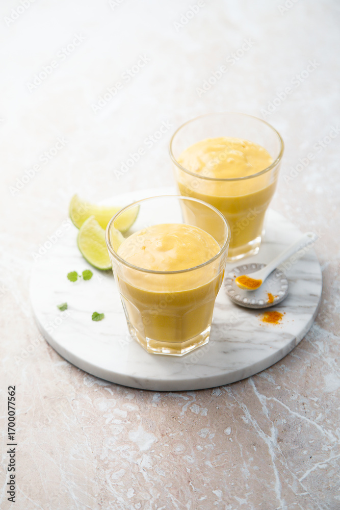 Fototapeta premium Healthy mango lassi with turmeric