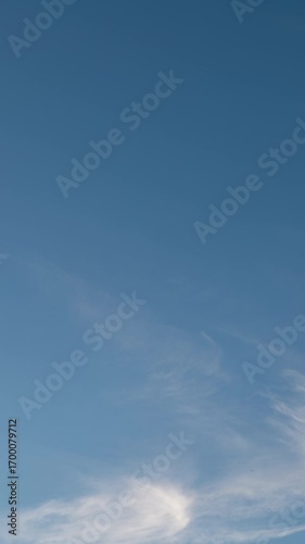 White Cirrus Clouds in Blue Sky (Vertical, Timelapse)