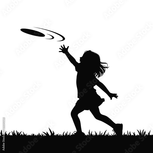 Silhouette of a girl reaching for a frisbee on a grassy field