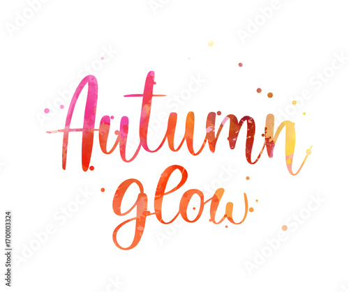 Colorful handwritten text saying 'Autumn glow' with scattered paint splashes. Seasonal modern calligraphy lettering text