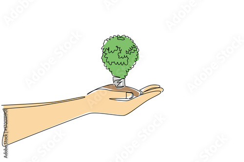 Single line draw of a hand holding a tree shaped like bulb lamp conveys global environment concept for World Environment Day, promoting eco awareness, sustainability, and conservation for the planet.