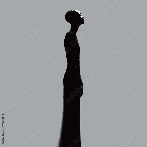 A tall figure stands in profile wearing a long black gown with a sleek silhouette against a gray backdrop. The posture conveys grace and poise.