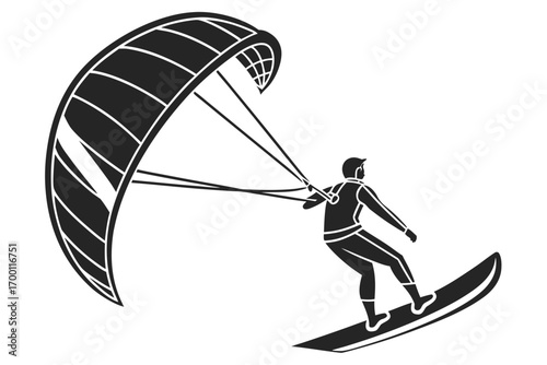 Kite surfer riding a board with a large kite
