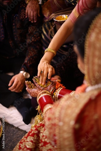 Wallpaper Mural Haldi Ceremony with Family Applying Turmeric to Bride’s Hands During Hindu Wedding Torontodigital.ca