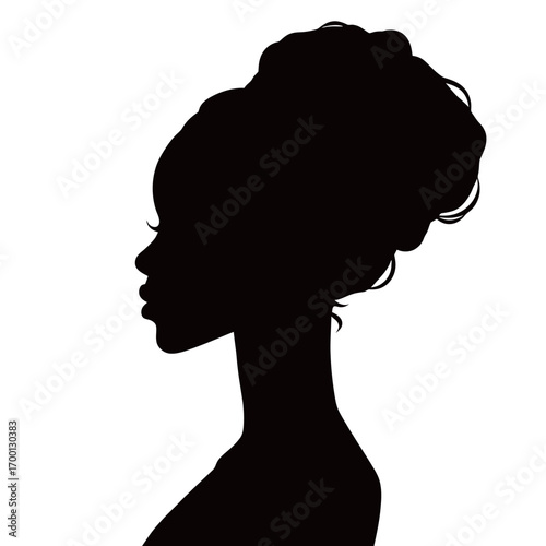 A graceful profile of a woman is captured, showcasing her stylish updo. The focus on her silhouette highlights timeless beauty and elegance.