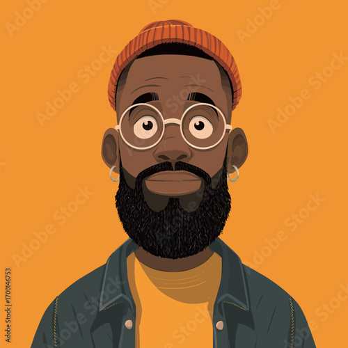 A young man with a thick beard and glasses poses with confidence, wearing a bright orange beanie and a denim jacket. The vibrant yellow backdrop enhances his unique style.