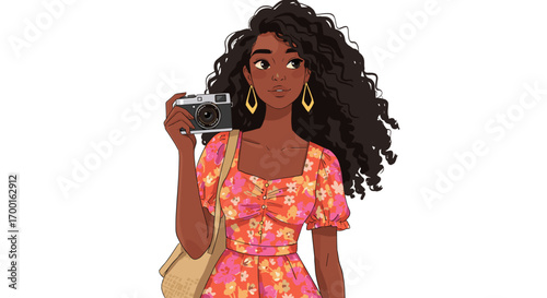 Young woman with curly dark hair holding vintage camera in floral dress isolated on white background