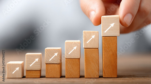Kpi performance measurement with wooden blocks arranged by hand to represent business growth and success strategy