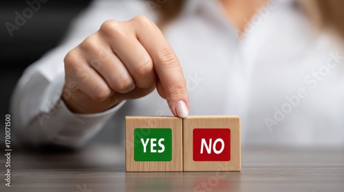 Decision-making moment captured with a hand ready to choose between affirmation and negation in an uncertain setting