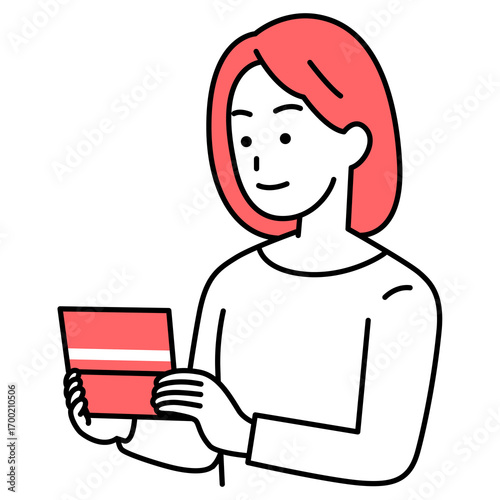預金通帳を見る若い女性