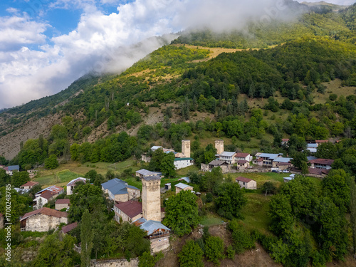 Mestia, Georgia, revealing its breathtaking landscape with houses, river, and majestic mountains