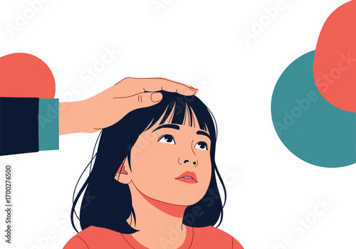 A caring hand gently pats a young child's head