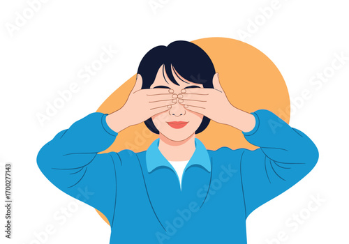 Young woman covering her eyes with both hands showing playful expression