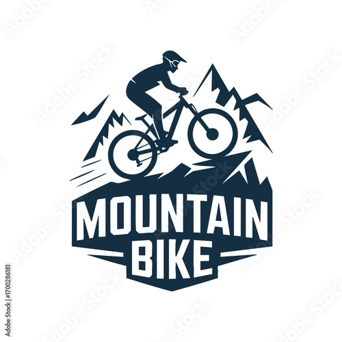 Dynamic mountain biking silhouette adventure over rugged peaks and mountains