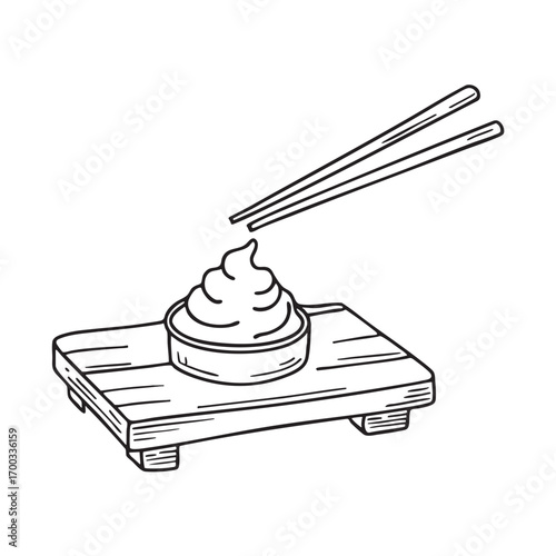 An illustration of wasabi on a wooden tray with chopsticks