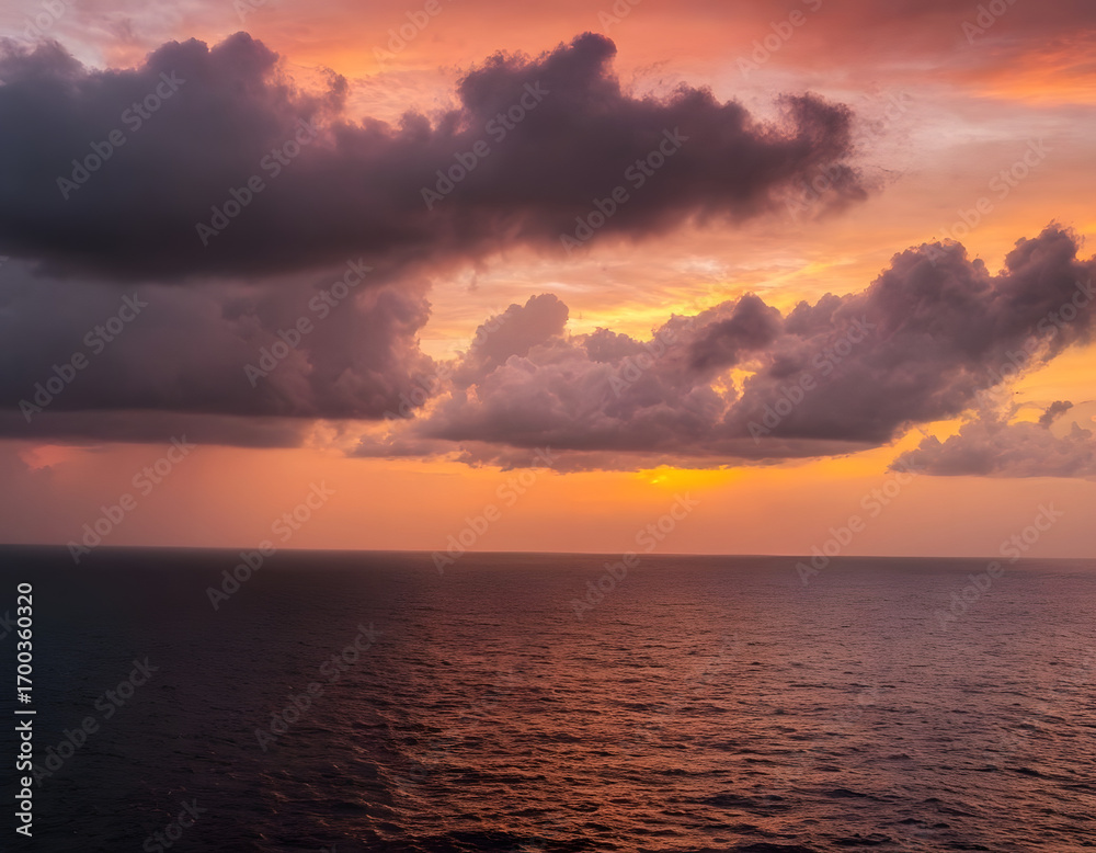 Fototapeta premium Amazing sunset on the sea of black and white clouds. A sunset at the beach.