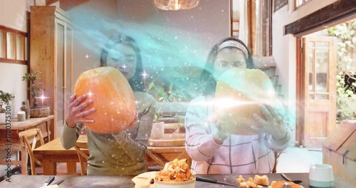Galaxy effect appearing around mother and daughter, driving DIY pumpkin carving and scooping