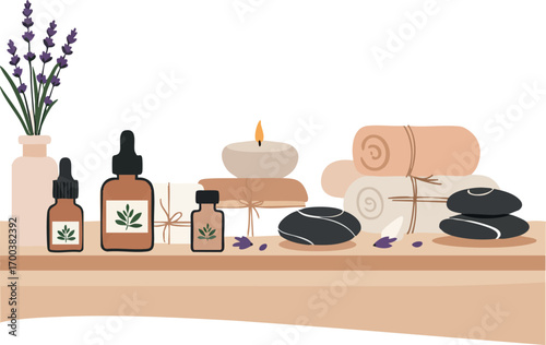 Aromatherapy essential oils lavender spa setup with rolled towels hot stones and candle for relaxation and wellness