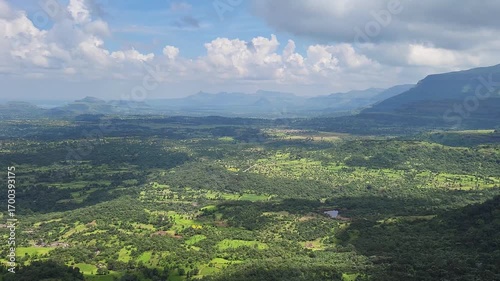 Aerial view from the mountain, showcasing lush greenery beneath drifting clouds from Shayadri Western ghat maharashtra