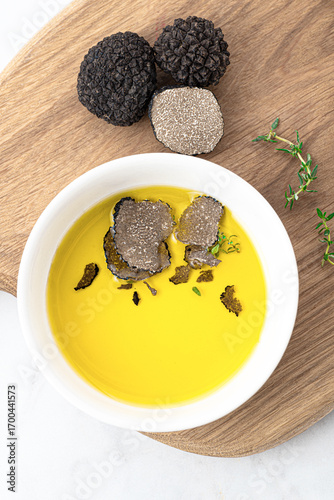 Wallpaper Mural Olive oil with black truffles. How to preserve the aroma of truffles. Fragrant autumn oil, gourmet supplement. Autumn gourmet cuisine of Piedmont, Northern Italy	 Torontodigital.ca