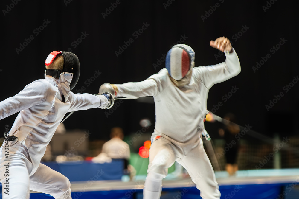 Fototapeta premium Two fencing athletes fight on professional sports arena