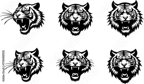 "Set of Roaring Tiger Head Silhouettes in Tribal Style"