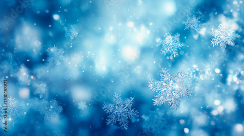 雪の結晶が浮かぶブルーの輝き背景（冬の風景）