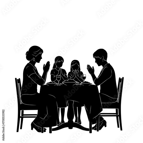 a family in the table prays