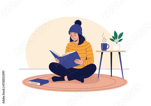 Cozy winter scene with a person enjoying a book indoors while staying warm