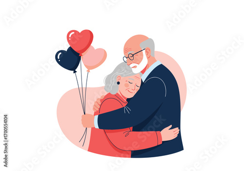 Loving elderly couple embracing together holding romantic heart shaped balloons